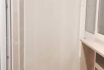 Панорамное остекление с тонировкой и отделка балкона